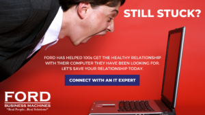 Man Yelling at Computer with Red Background